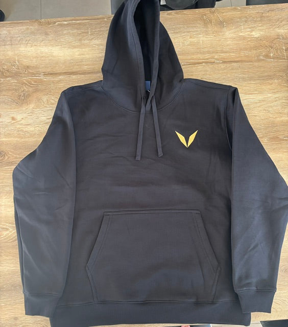 Actual black Voltare hoodie sample laid flat, showing the gold V embroidery on the left chest.