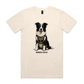 Ecru Voltare adult tee featuring a black-and-white Border Collie wearing a tan harness with an Operations Manager badge, paw-print detail and black Border Collie lettering.