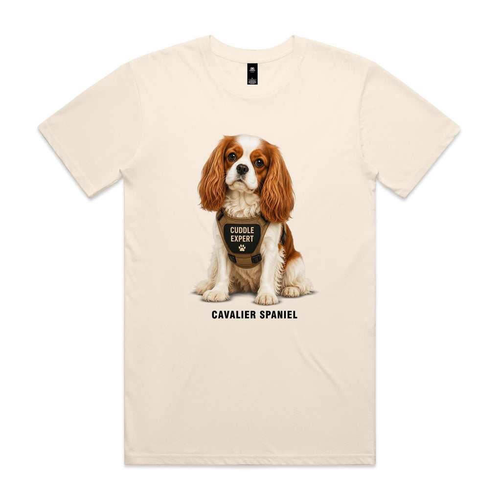 Ecru Voltare Cavalier Spaniel tee featuring a chestnut-and-white dog in a tan harness with Cuddle Expert wording