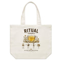Front of Voltare Chamomile Ritual natural canvas tote bag with golden tea, glass cup, white chamomile flowers and illustrated brewing steps