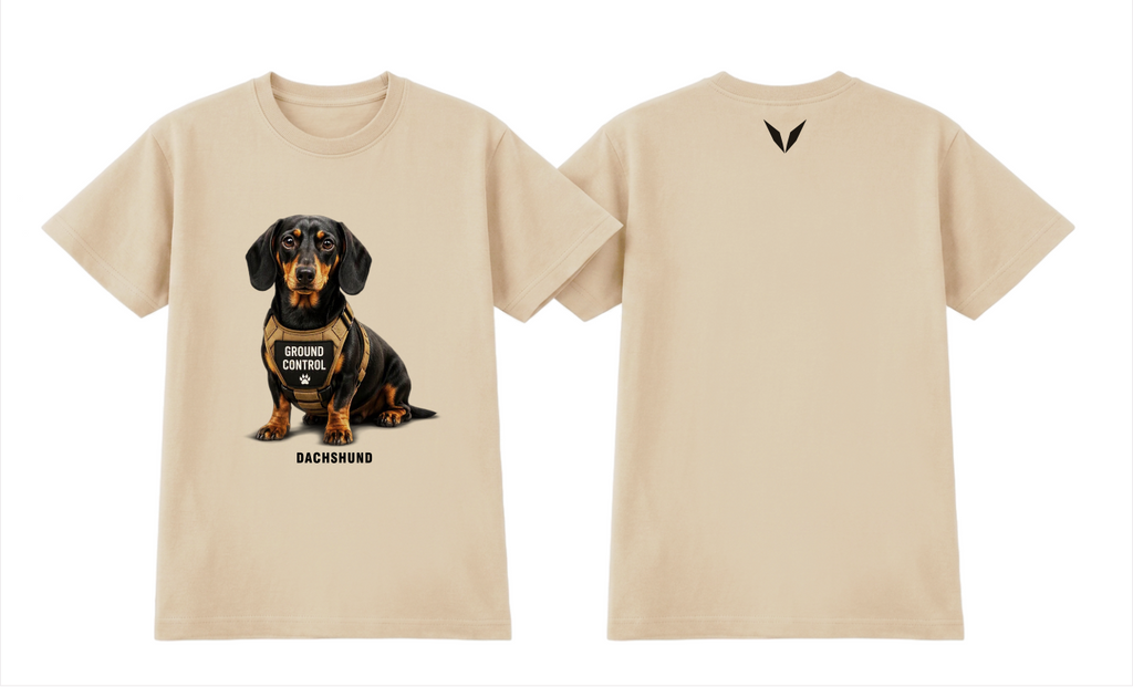 Front and back of the Voltare Dachshund Ground Control Tee in Ecru, showing black-and-tan Dachshund artwork, GROUND CONTROL harness and near-black back V.