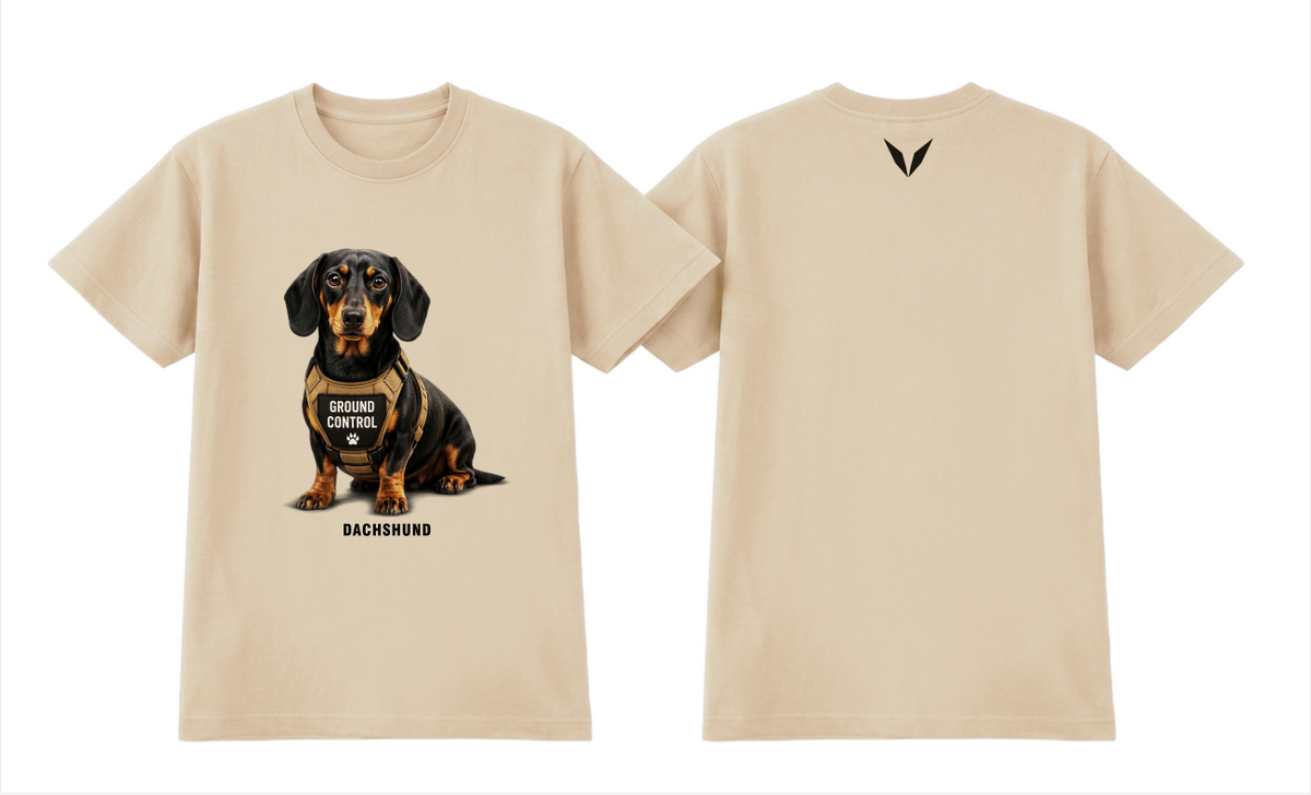 Front and back of the Voltare Dachshund Ground Control Tee in Ecru, showing black-and-tan Dachshund artwork, GROUND CONTROL harness and near-black back V.