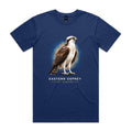 Front of the cobalt Voltare Eastern Osprey Sky Hunters T-shirt with an illustrated osprey featuring a pale chest, dark eye stripe and brown wings against a blue-and-sand backdrop.