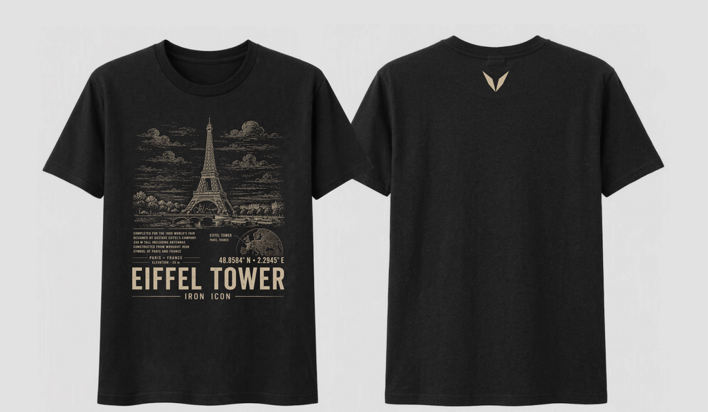 Front and back of the black Voltare Eiffel Tower Iron Icon tee, showing Eiffel Tower artwork above facts, a Paris map, coordinates and landmark lettering, with a sand-coloured Voltare V high on the back