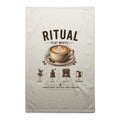 Voltare Flat White Ritual cream tea towel with latte art, coffee cup and saucer, coffee beans and illustrated coffee-making steps