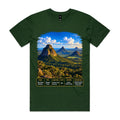Front of Voltare Forest Green Glass House Mountains T-shirt featuring rocky peaks, lush forest and a Queensland fact panel.