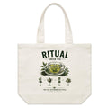Front of Voltare Green Tea Ritual natural canvas tote bag with glass tea cup, leafy branches, teapot and hourglass brewing steps