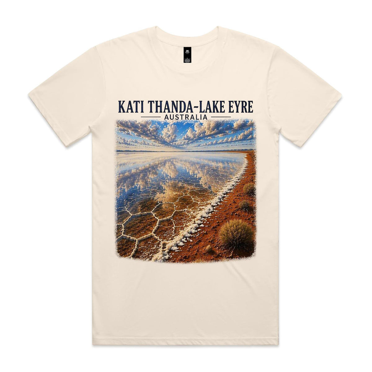 Ecru Voltare Kati Thanda-Lake Eyre tee featuring cloud reflections, patterned salt crust and a red-earth shoreline beneath Kati Thanda-Lake Eyre Australia lettering