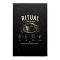 Voltare Long Black Ritual black tea towel with cream lettering, black coffee cup and saucer, coffee beans and illustrated coffee-making steps