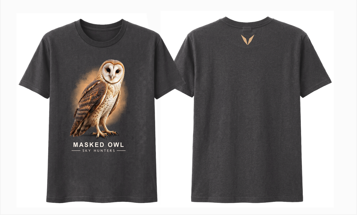 Front and back views of the charcoal Voltare Masked Owl Sky Hunters T-shirt, with illustrated owl artwork against an amber backdrop and a small tan Voltare V logo on the upper back.
