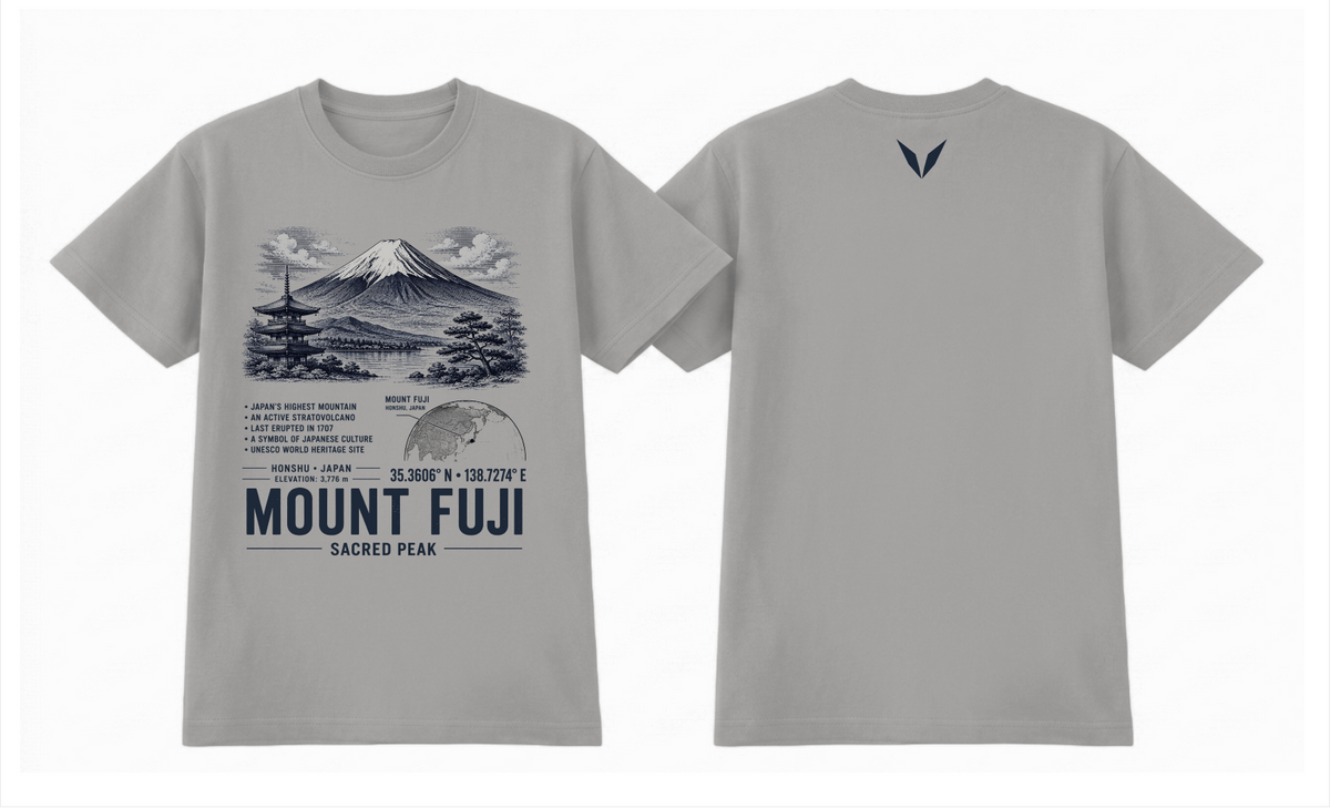 Front and back of the Grey Marle Voltare Mount Fuji Sacred Peak tee, showing mountain, pagoda and lake artwork above facts, a Japan map, coordinates and landmark lettering, with a small dark Voltare V high on the back