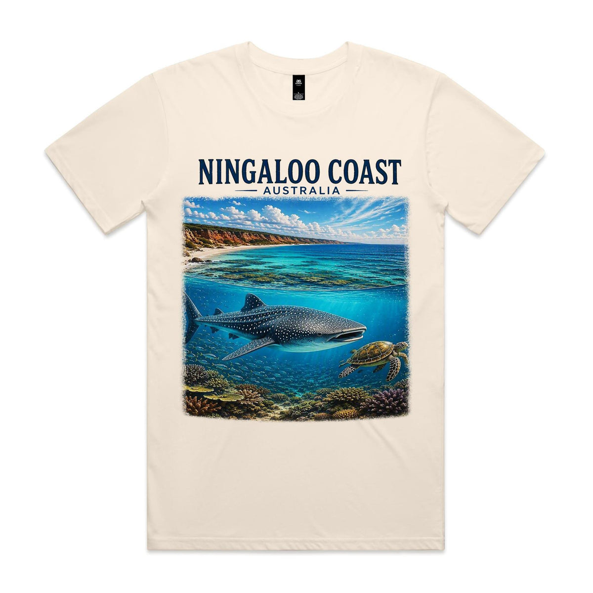 Ecru Voltare Ningaloo Coast tee featuring a whale shark and sea turtle above coral beneath turquoise coastal water and Ningaloo Coast Australia lettering
