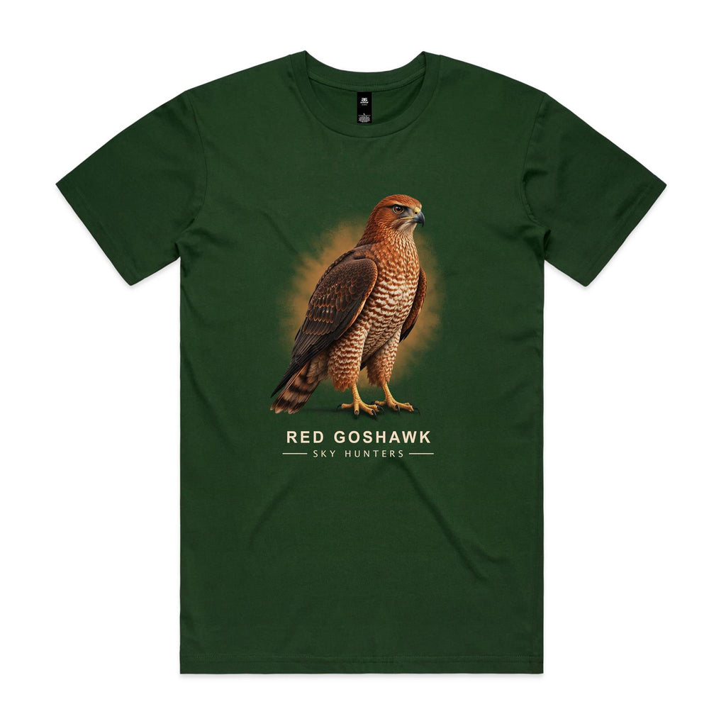 Front of the forest green Voltare Red Goshawk Sky Hunters T-shirt with an illustrated reddish-brown bird, dark wings and a patterned chest against a warm ochre backdrop.
