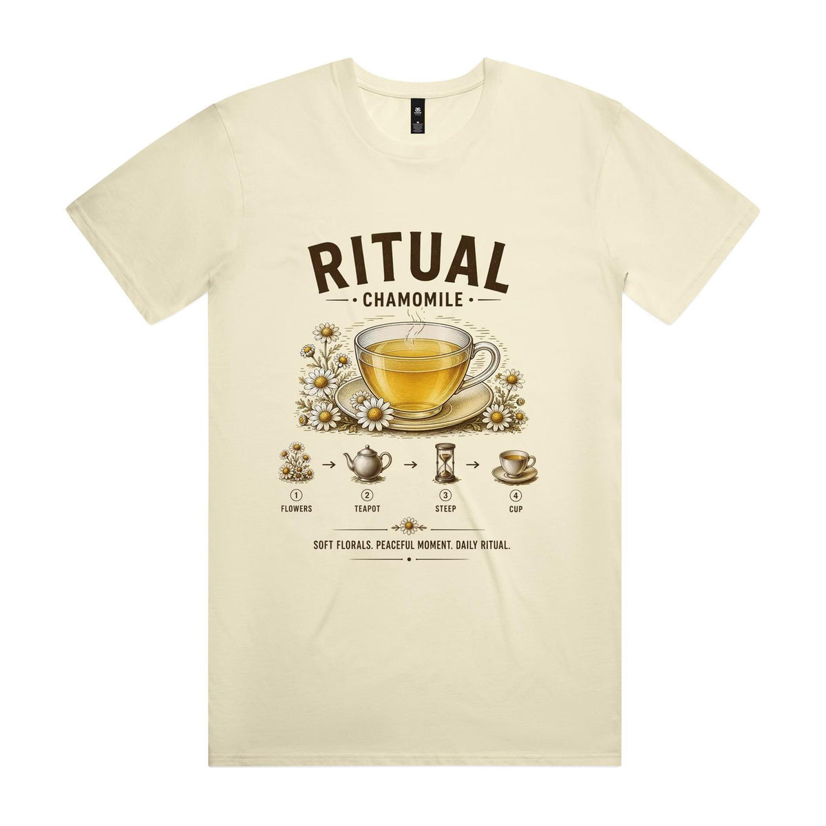 Front of the butter Voltare Ritual Chamomile T-shirt with an engraved glass cup of chamomile tea ringed with daisies and the four-step flowers, teapot, steep, cup method.