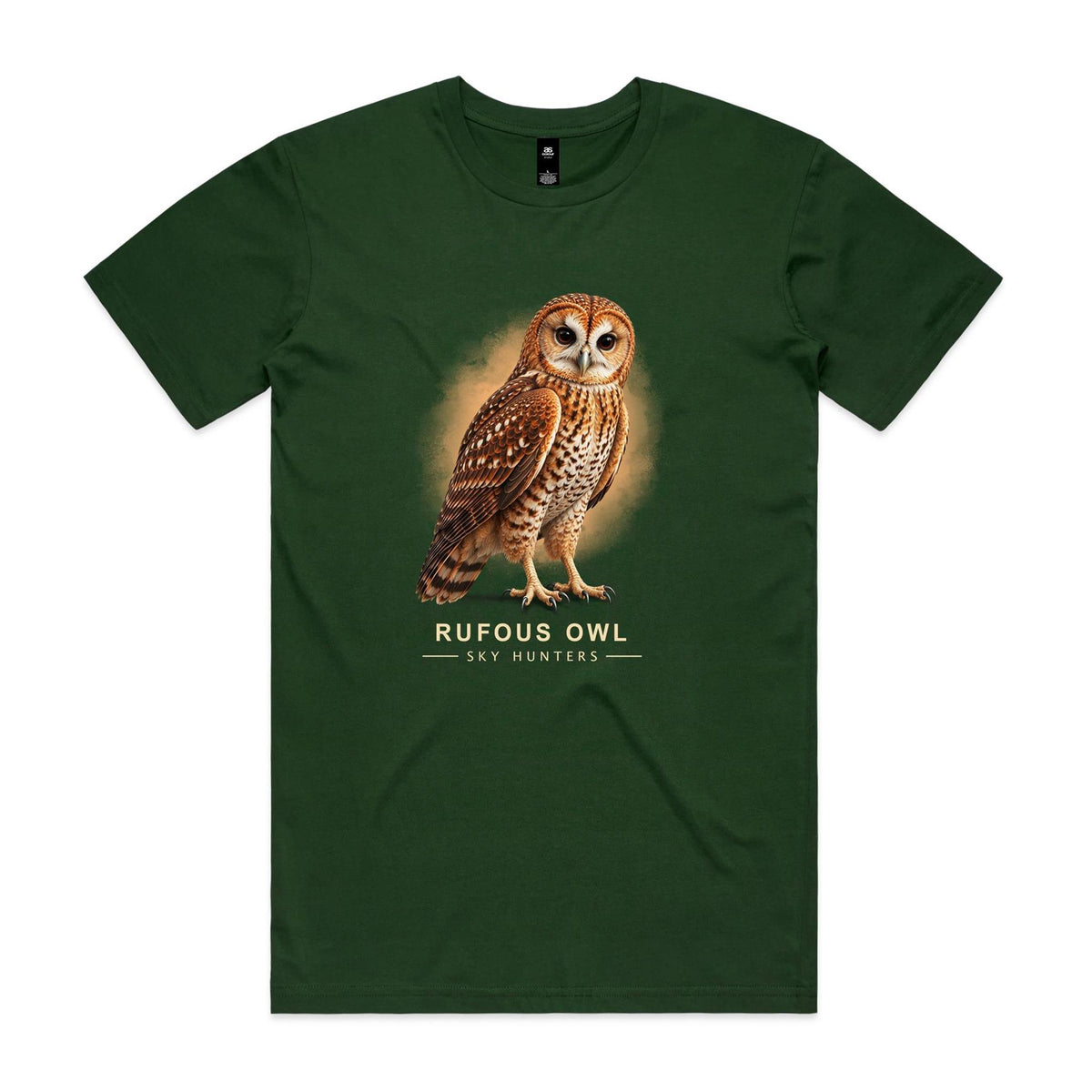 Front of the forest green Voltare Rufous Owl Sky Hunters T-shirt with an illustrated reddish-brown owl, a pale patterned chest and large dark eyes against a warm sandy backdrop.