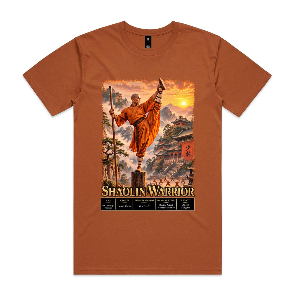 Copper Voltare Shaolin Warrior tee featuring an orange-robed martial artist with a staff, mountain temples, sunset scenery and historical fact panels