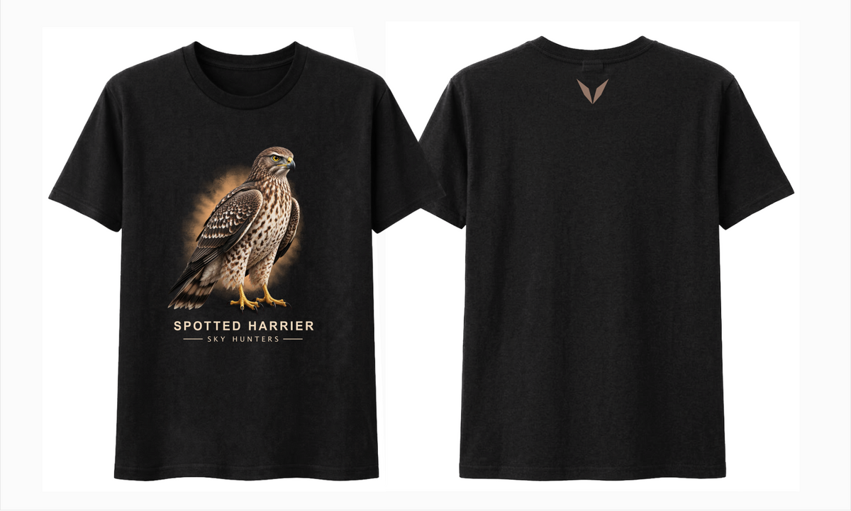 Front and back views of the black Voltare Spotted Harrier Sky Hunters T-shirt, with illustrated harrier artwork against an amber backdrop and a small muted brown Voltare V logo on the upper back.