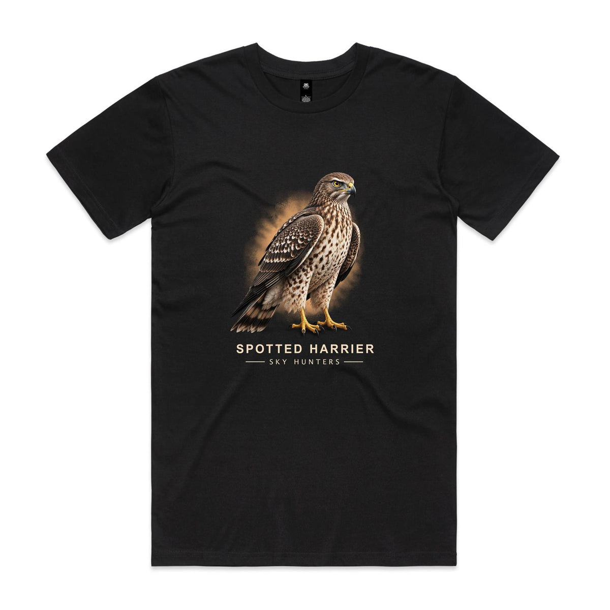 Front of the black Voltare Spotted Harrier Sky Hunters T-shirt with an illustrated bird featuring a yellow eye, brown wings and a pale spotted chest against a warm amber backdrop.