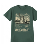 Front of the Pine Green Voltare Statue of Liberty Beacon of Freedom tee, featuring Statue of Liberty and New York skyline artwork above historical facts, a location map, coordinates and Statue of Liberty Beacon of Freedom lettering