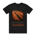 Front of Voltare Valles Marineris black tee with copper-orange Martian canyon artwork, steep cliffs, canyon-facts panel and orange lettering