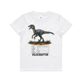 White Voltare kids tee with blue-grey feathered Velociraptor artwork, a dinosaur facts panel and black Velociraptor lettering on the front.