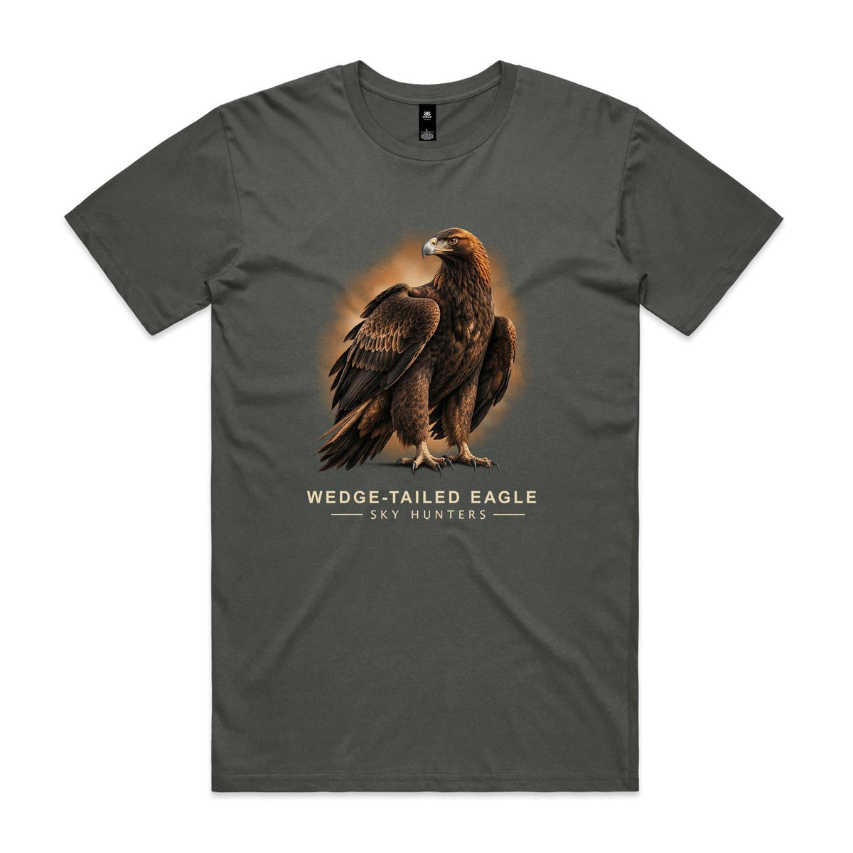 Front of the charcoal Voltare Wedge-tailed Eagle Sky Hunters T-shirt with an illustrated dark-brown eagle, golden-brown neck feathers and a hooked beak against a warm orange backdrop.
