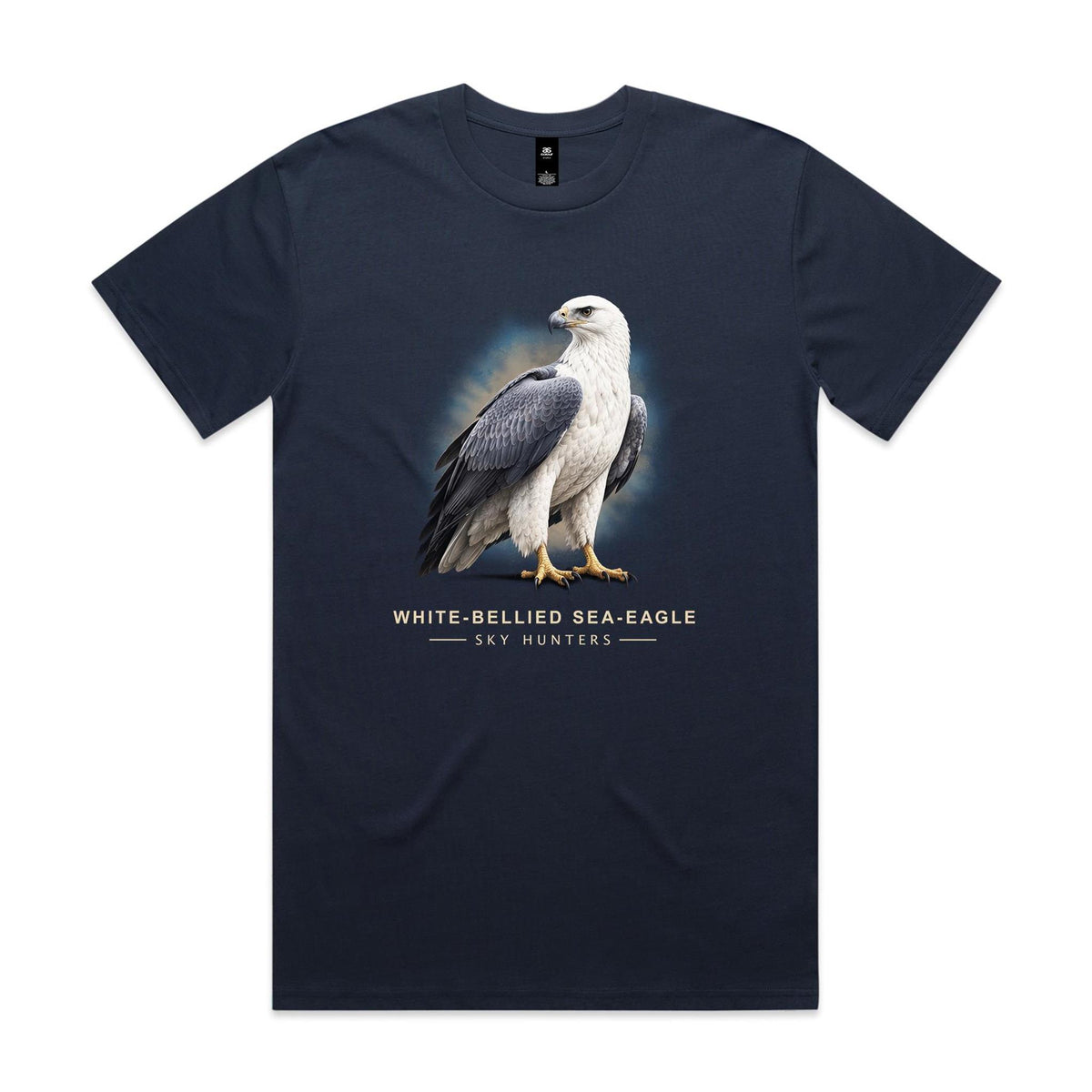 Front of the midnight blue Voltare White-bellied Sea-Eagle Sky Hunters T-shirt with an illustrated bird featuring a white head and chest and slate-grey wings against a blue-and-sand backdrop.