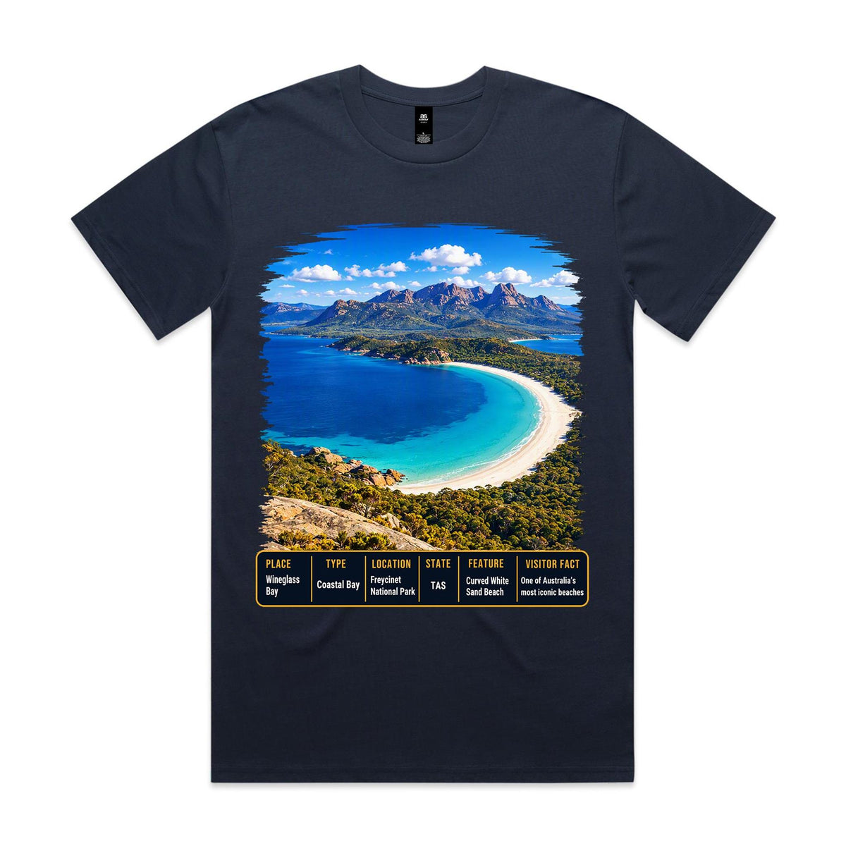 Front of Voltare Midnight Blue Wineglass Bay T-shirt featuring turquoise water, a curved white-sand beach, mountains and a Tasmania fact panel.